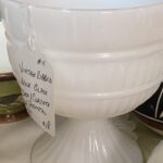 a piece of vintage milk glass on a shelf at Salt River Antiques in St Marys, Georgia