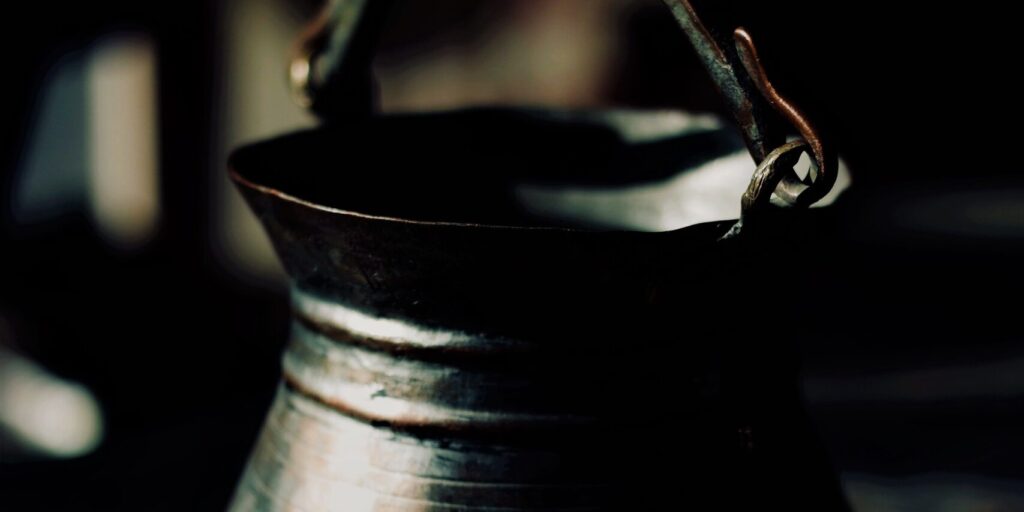 closeup of a vintage metal pot with a beautiful patina