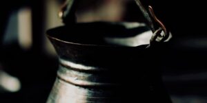 closeup of a vintage metal pot with a beautiful patina