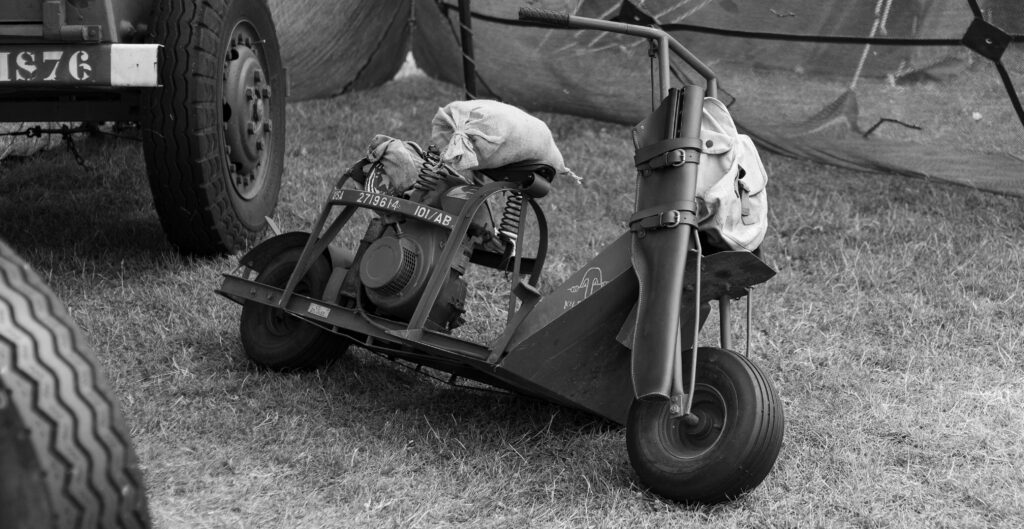 a black and white image of a military motorcycle
