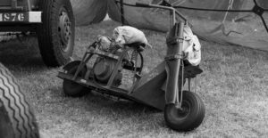 a black and white image of a military motorcycle